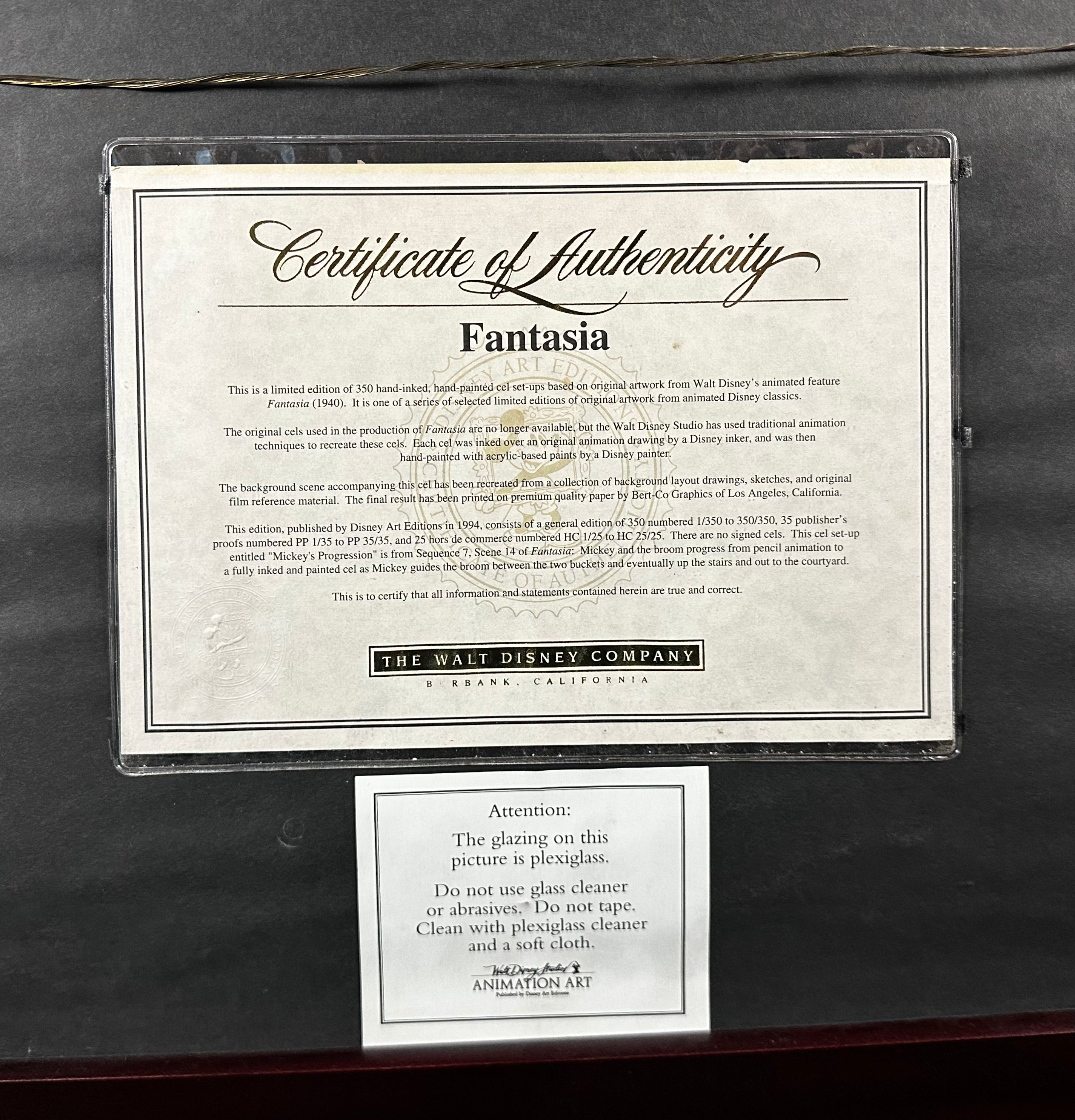 Certificate of Authenticity for 'Fantasia' with a clear protective overlay on a dark surface.