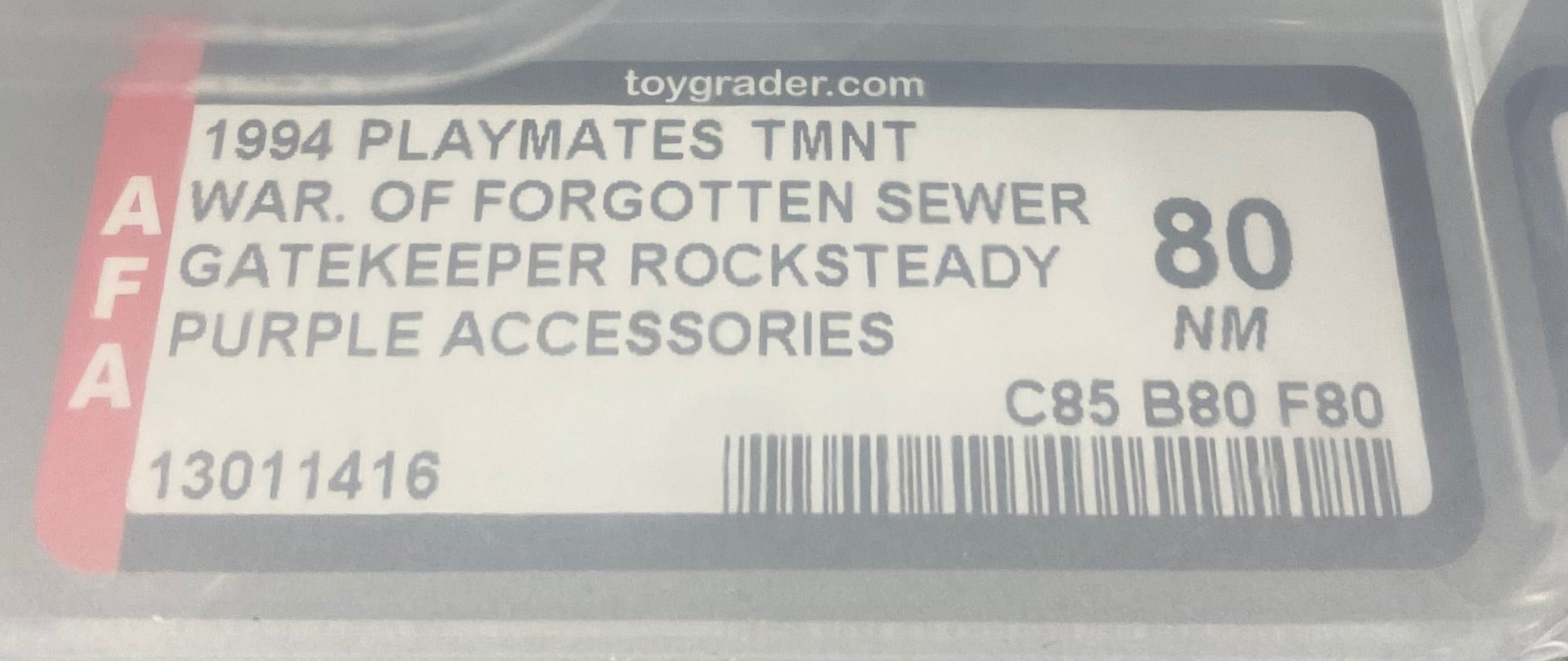Teenage Mutant Ninja Turtles Gatekeeper Rock Steady Purple Weapons boxed figure AFA graded 80. Label photo close-up.