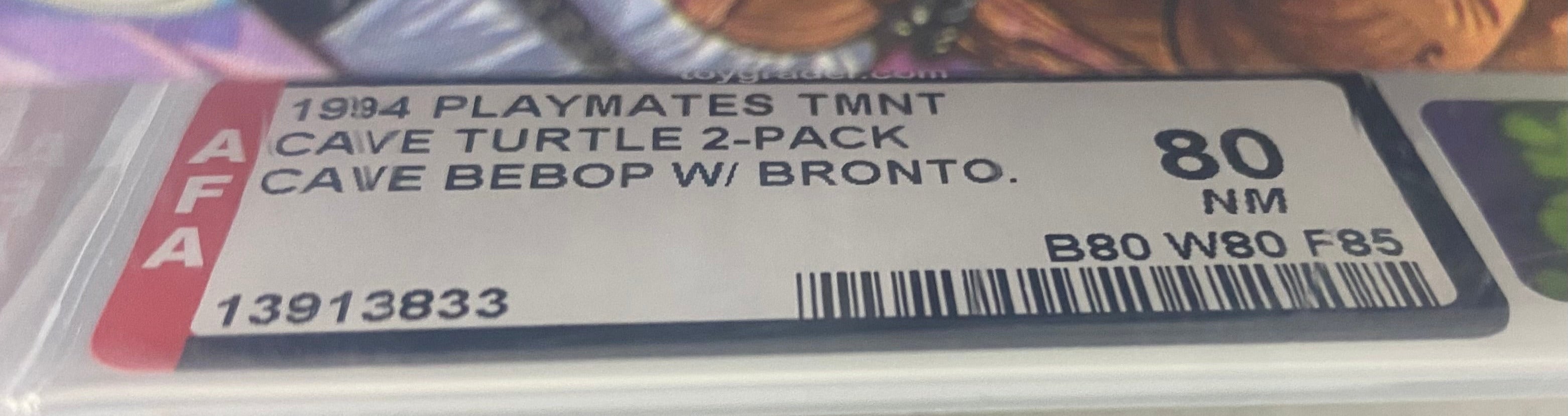 Teenage Mutant Ninja Turtles Cave-Beast Bebop and his Bodacious Brontosaurus Boxed Figure graded AFA 80. Grade Label Photo close-up.