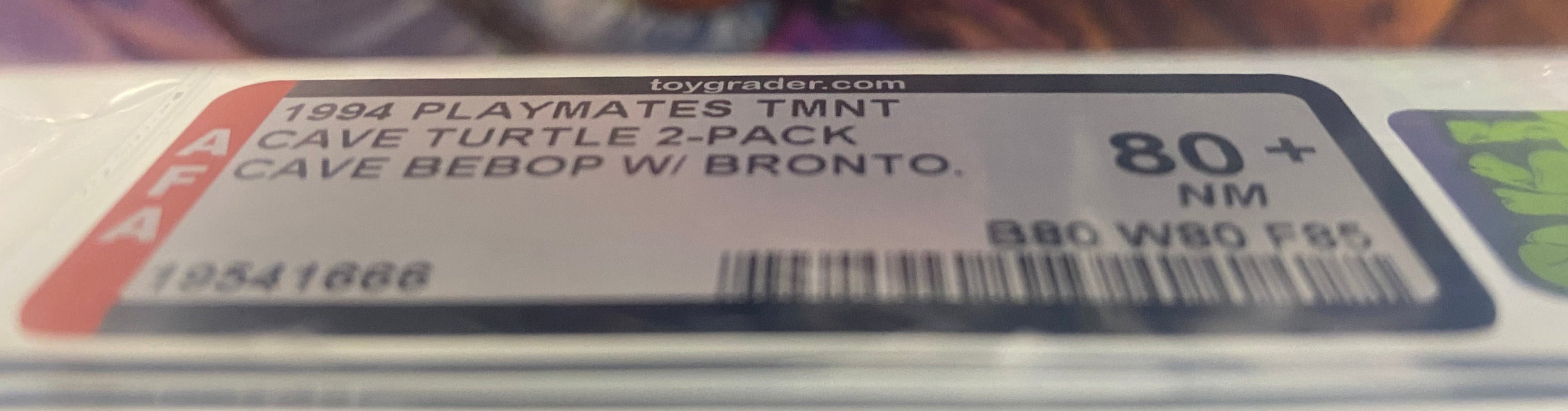Teenage Mutant Ninja Turtles Cave-Beast Bebop and his Bodacious Brontosaurus Boxed Figure graded AFA 80+.  Graded label photo close-up.