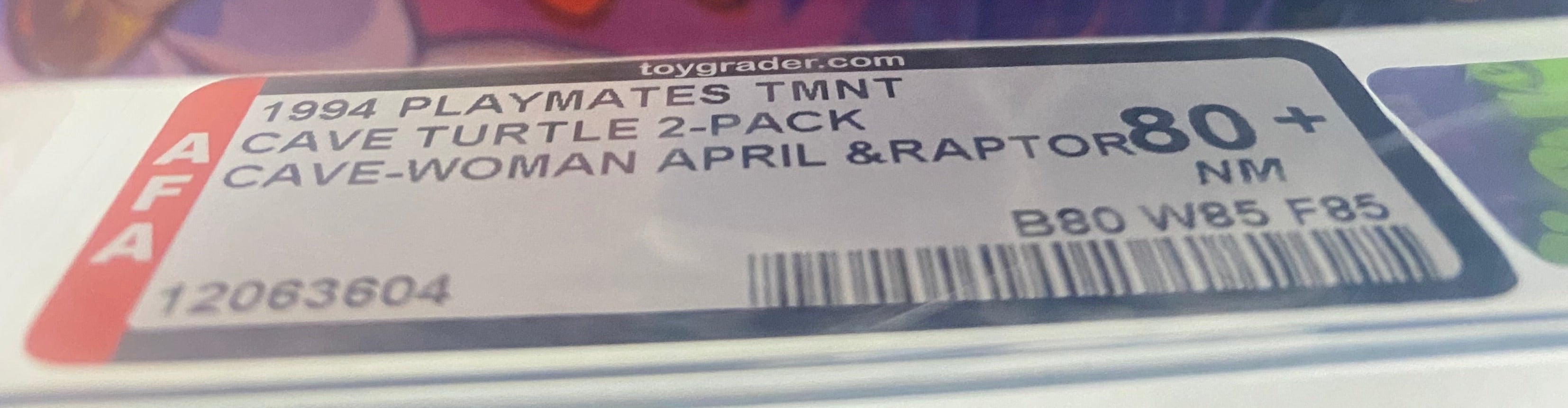 Teenage Mutant Ninja Turtles Cave Woman April and Radical Raptor graded AFA 80+. Label photo close-up.