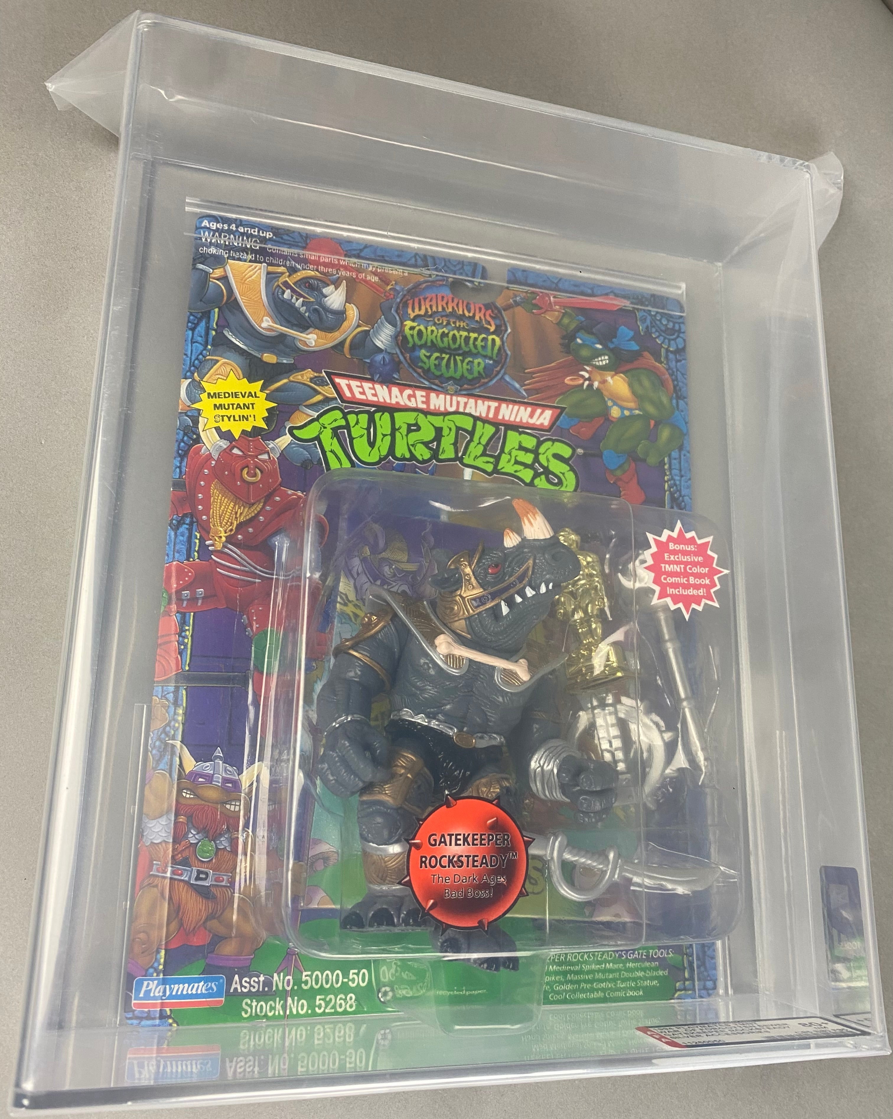 Teenage Mutant Ninja Turtles Gatekeeper Rock Steady Silver Weapons boxed figure AFA graded 80+. Front photo.