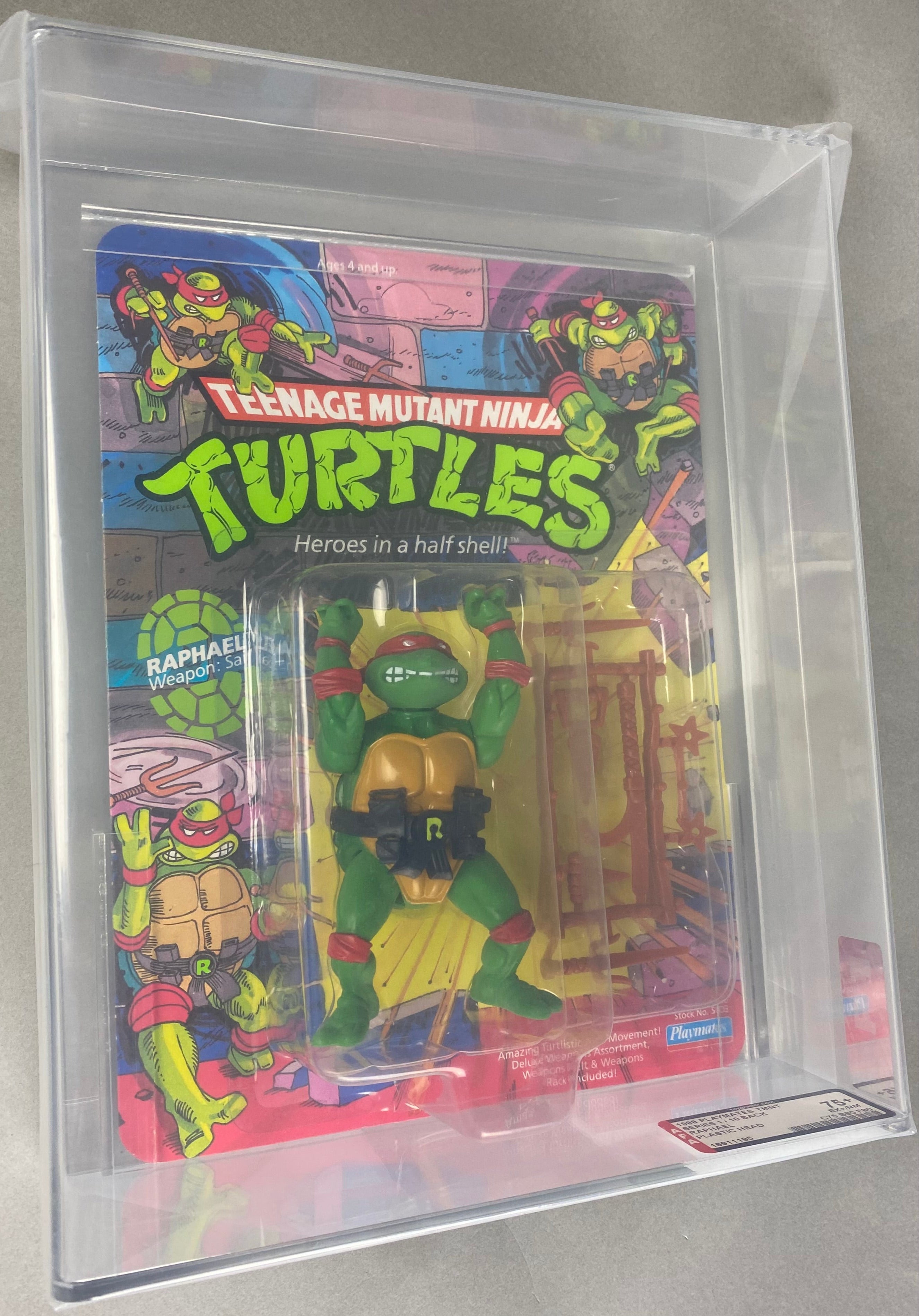 Teenage Mutant Ninja Turtles Raphael Heroes in a Half Shell boxed figure AFA graded 75+. Front photo.