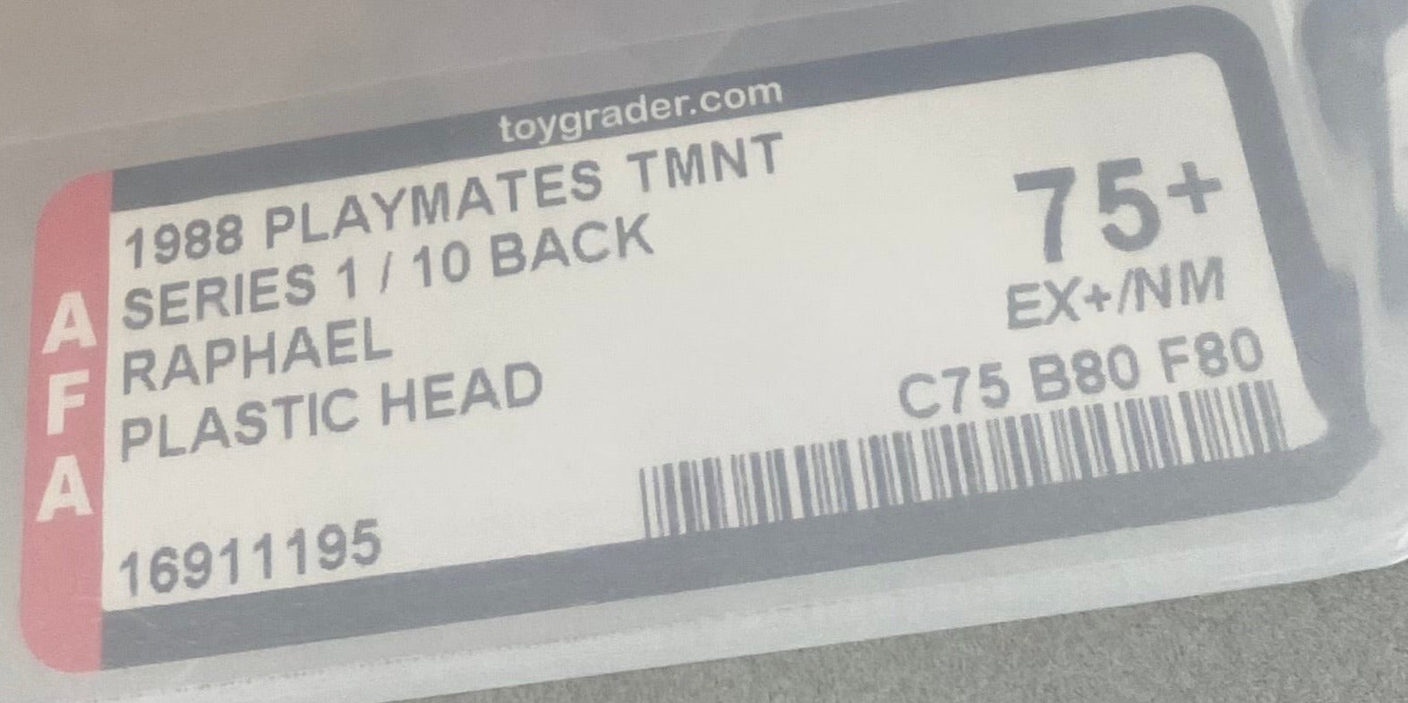 Teenage Mutant Ninja Turtles Raphael Heroes in a Half Shell boxed figure AFA graded 75+.  Label photo close-up.